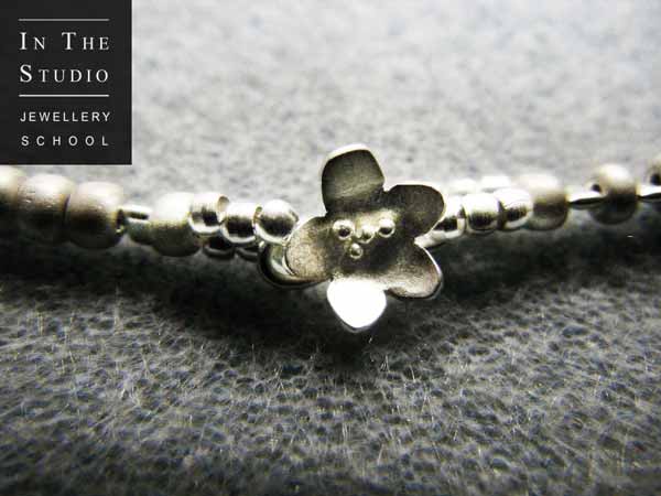 Argentium silver flower on link