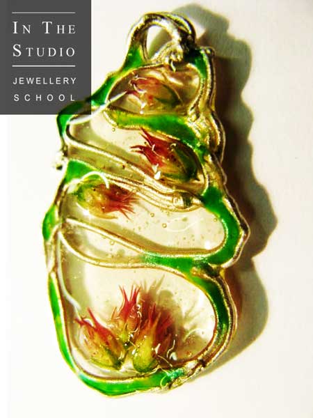 Flowers-Set-in-Resin-within-Silver-Pendant