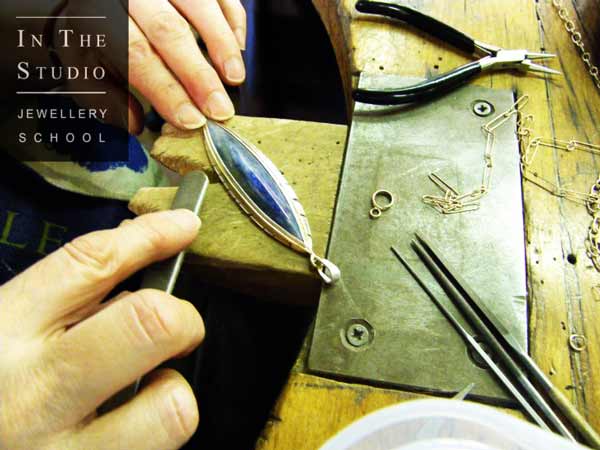 Polishing-Stone-Set-Pendant-at-the-Bench