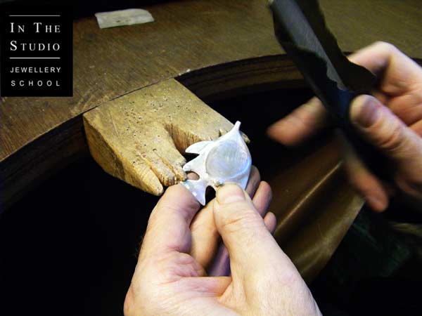 Student-Filing-Cast-Silver-at-the-bench